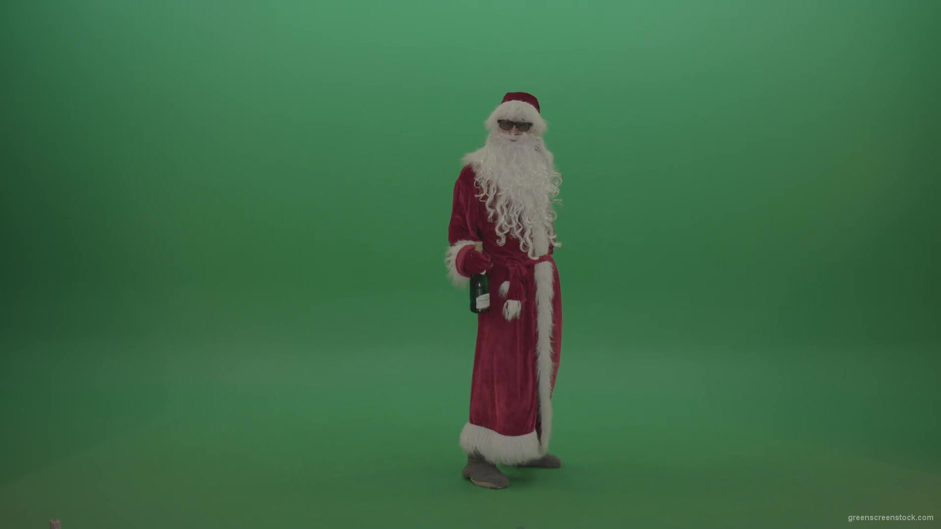 Drunk-santa-in-black-glasses-with-a-bottle-of-wine-staggers-across-the-green-screen-background-1920_005 Green Screen Stock