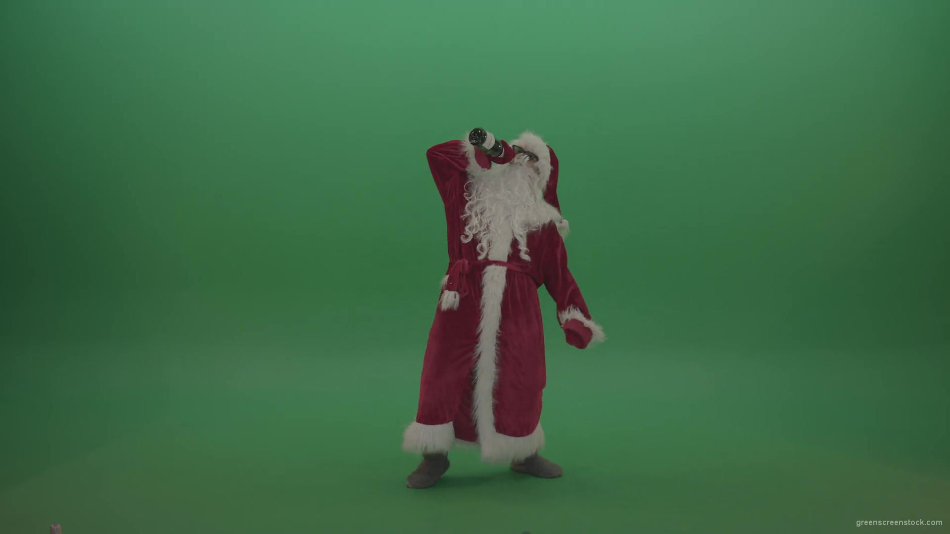 Drunk-santa-in-black-glasses-with-a-bottle-of-wine-staggers-across-the-green-screen-background-1920_007 Green Screen Stock