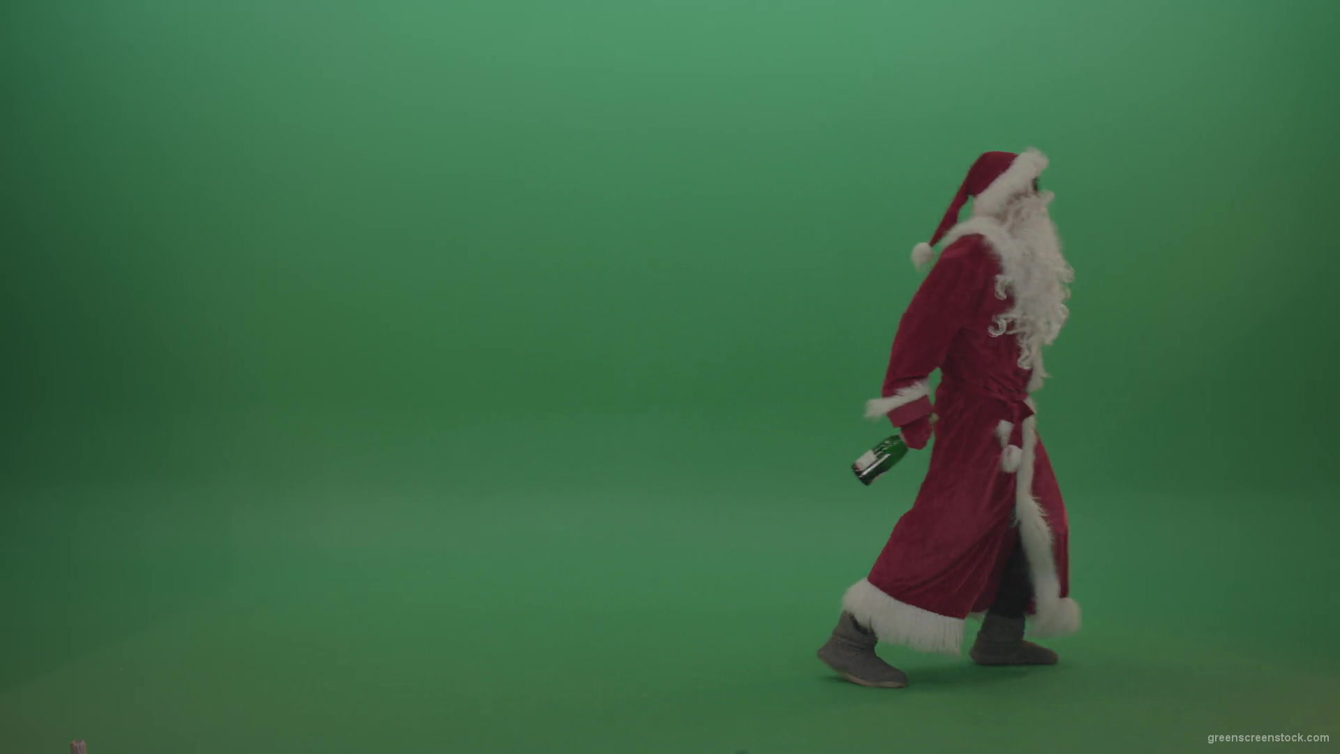 Drunk-santa-in-black-glasses-with-a-bottle-of-wine-staggers-across-the-green-screen-background-1920_009 Green Screen Stock