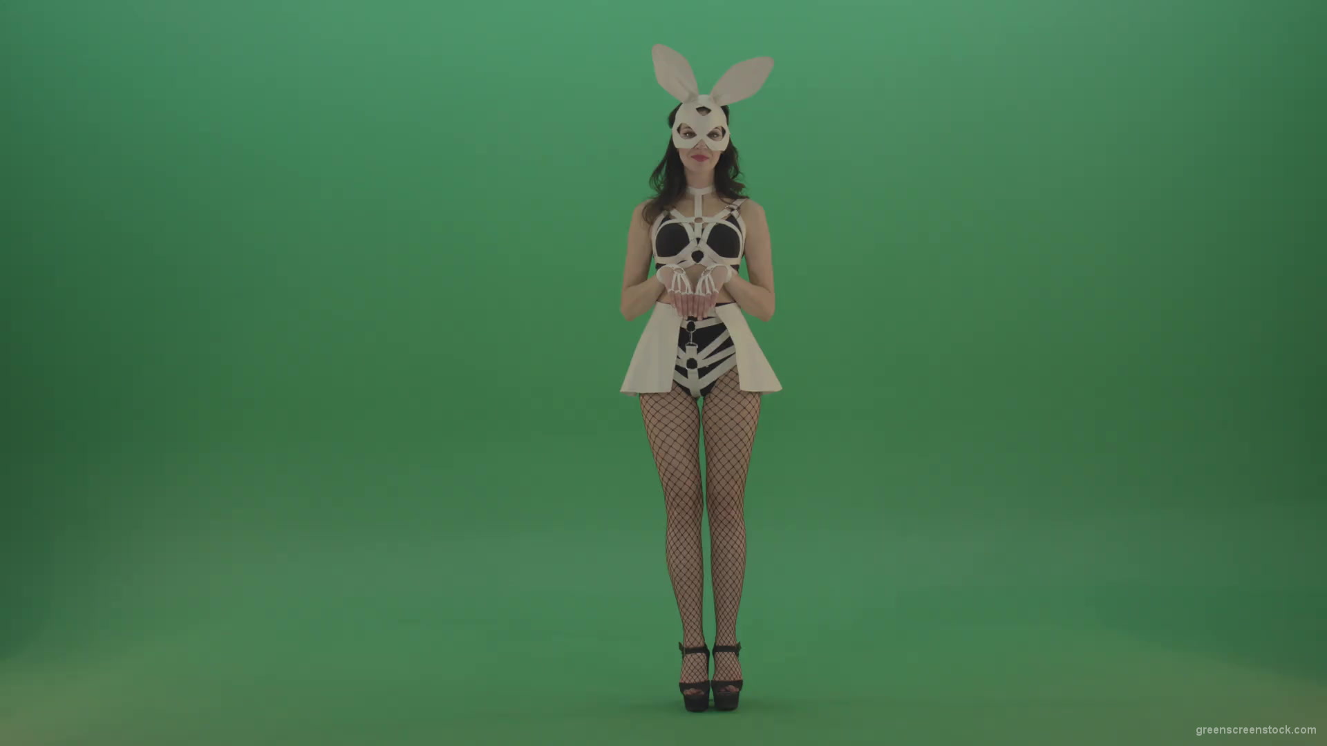 Happy-girl-dressed-in-rabbit-costume-for-adults-cyclically-jumping-in-different-directions-with-white-ears-on-chromakey-background-1920_001 Green Screen Stock