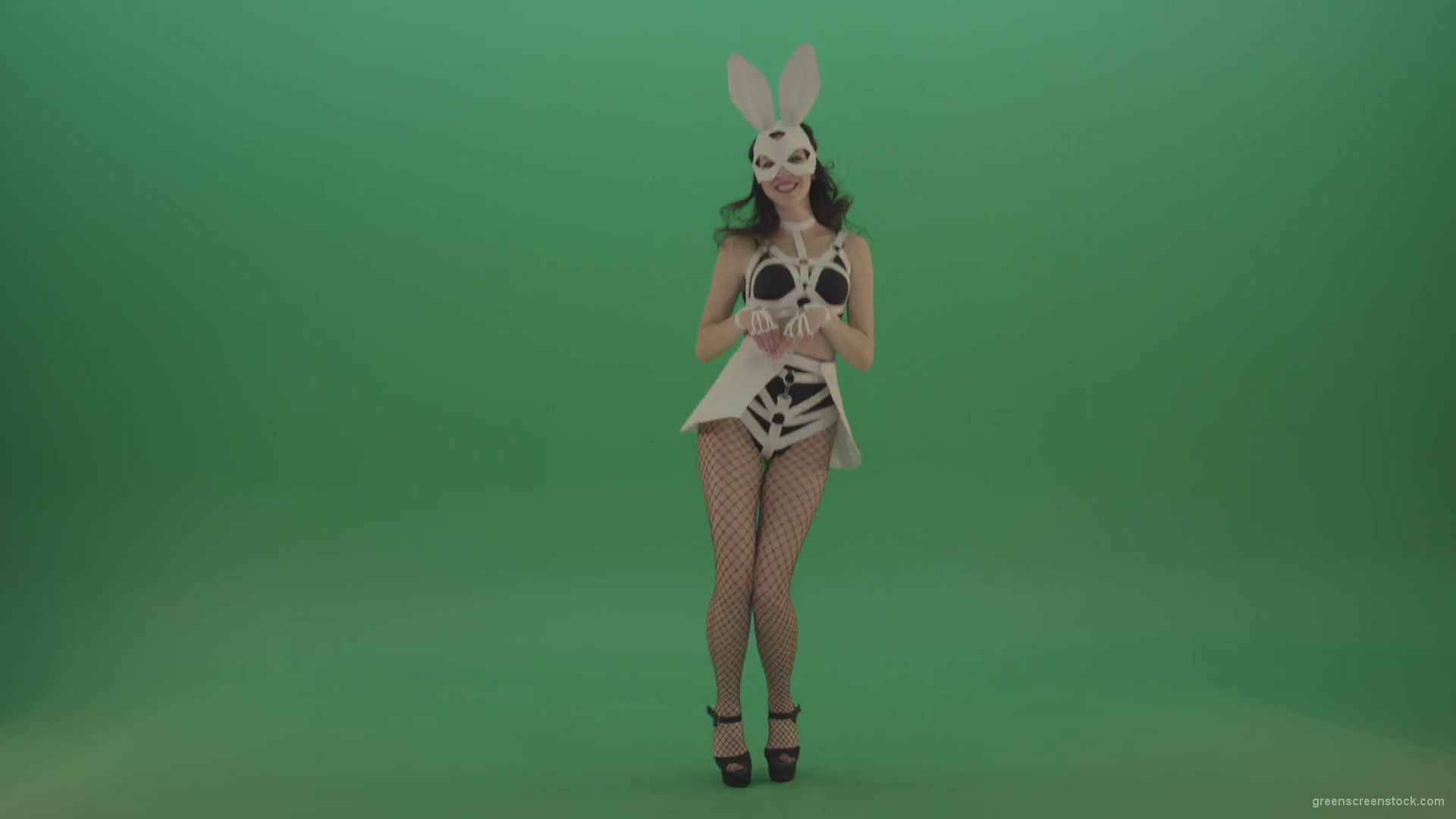 Happy-girl-dressed-in-rabbit-costume-for-adults-cyclically-jumping-in-different-directions-with-white-ears-on-chromakey-background-1920_006 Green Screen Stock