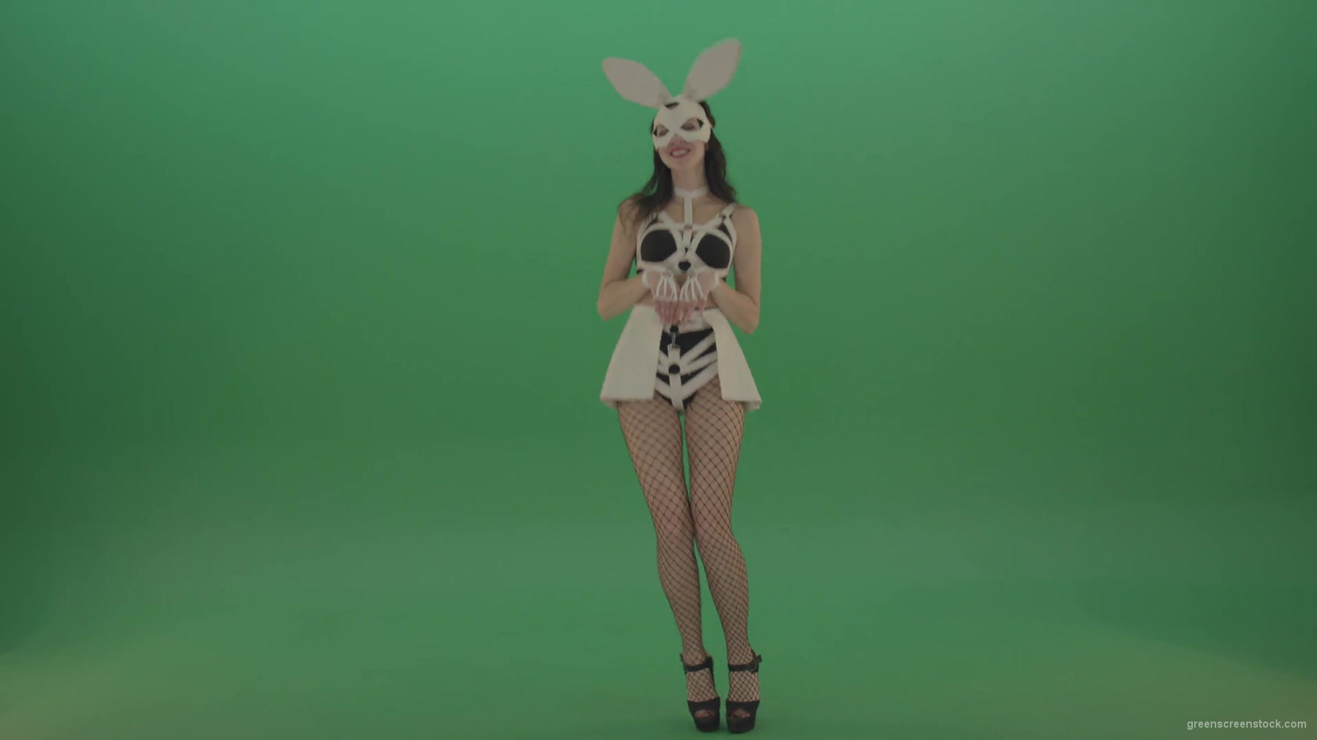 Happy-girl-dressed-in-rabbit-costume-for-adults-cyclically-jumping-in-different-directions-with-white-ears-on-chromakey-background-1920_009 Green Screen Stock