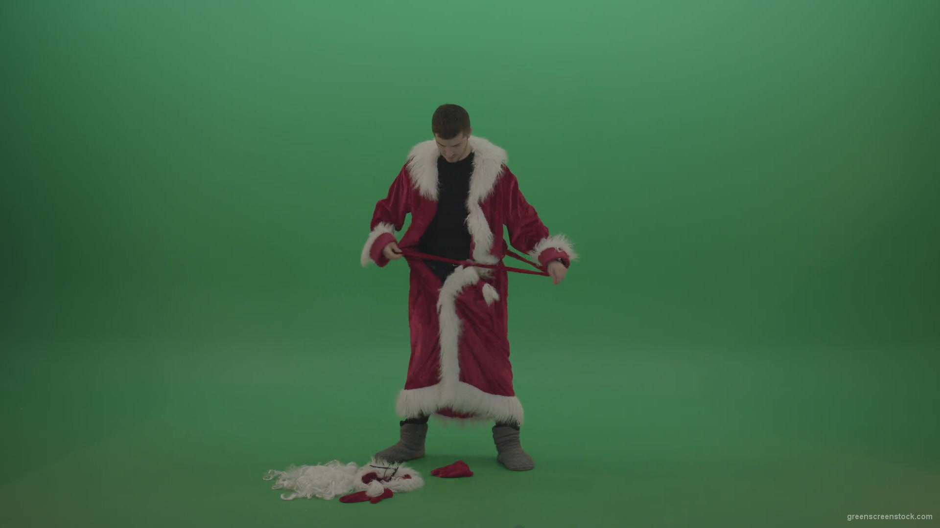 Man-takes-off-his-santa-costumes-over-green-screen-background-1920_007 Green Screen Stock
