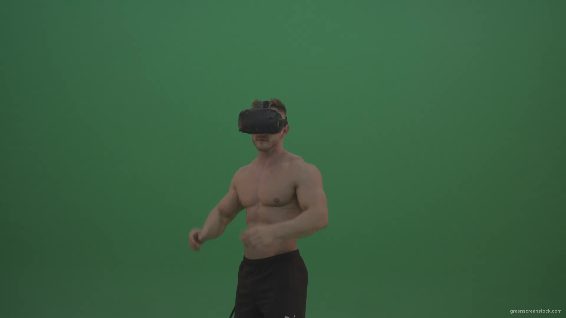 Young_Athletic_Bodybuilder_Working_On_Touch_Pad_Using_Virtual_Reality_Kit_On_Green_Screen_Wall_Background-1920_001 Green Screen Stock