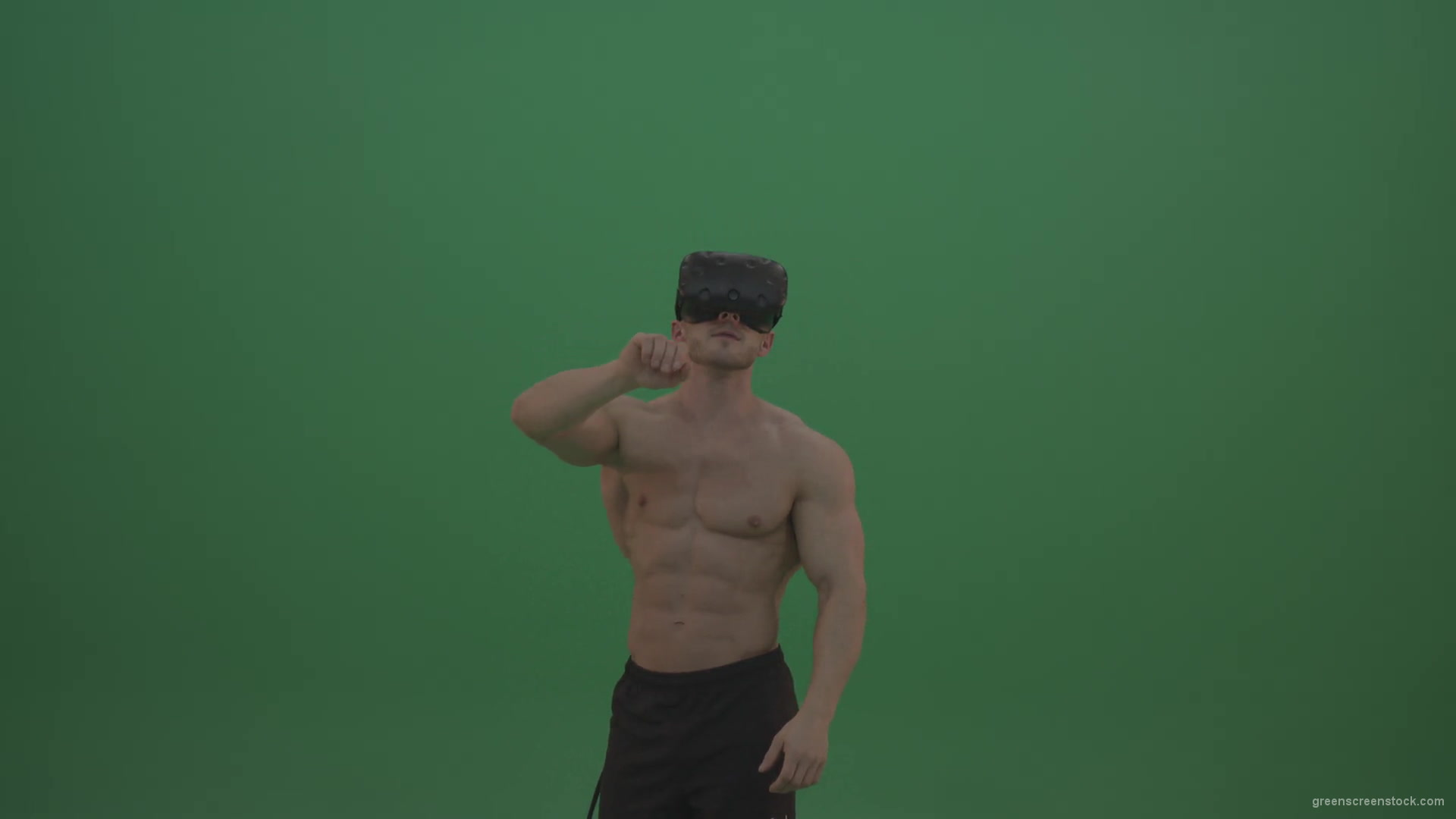 vj video background Young_Athletic_Bodybuilder_Working_On_Touch_Pad_Using_Virtual_Reality_Kit_On_Green_Screen_Wall_Background-1920_003