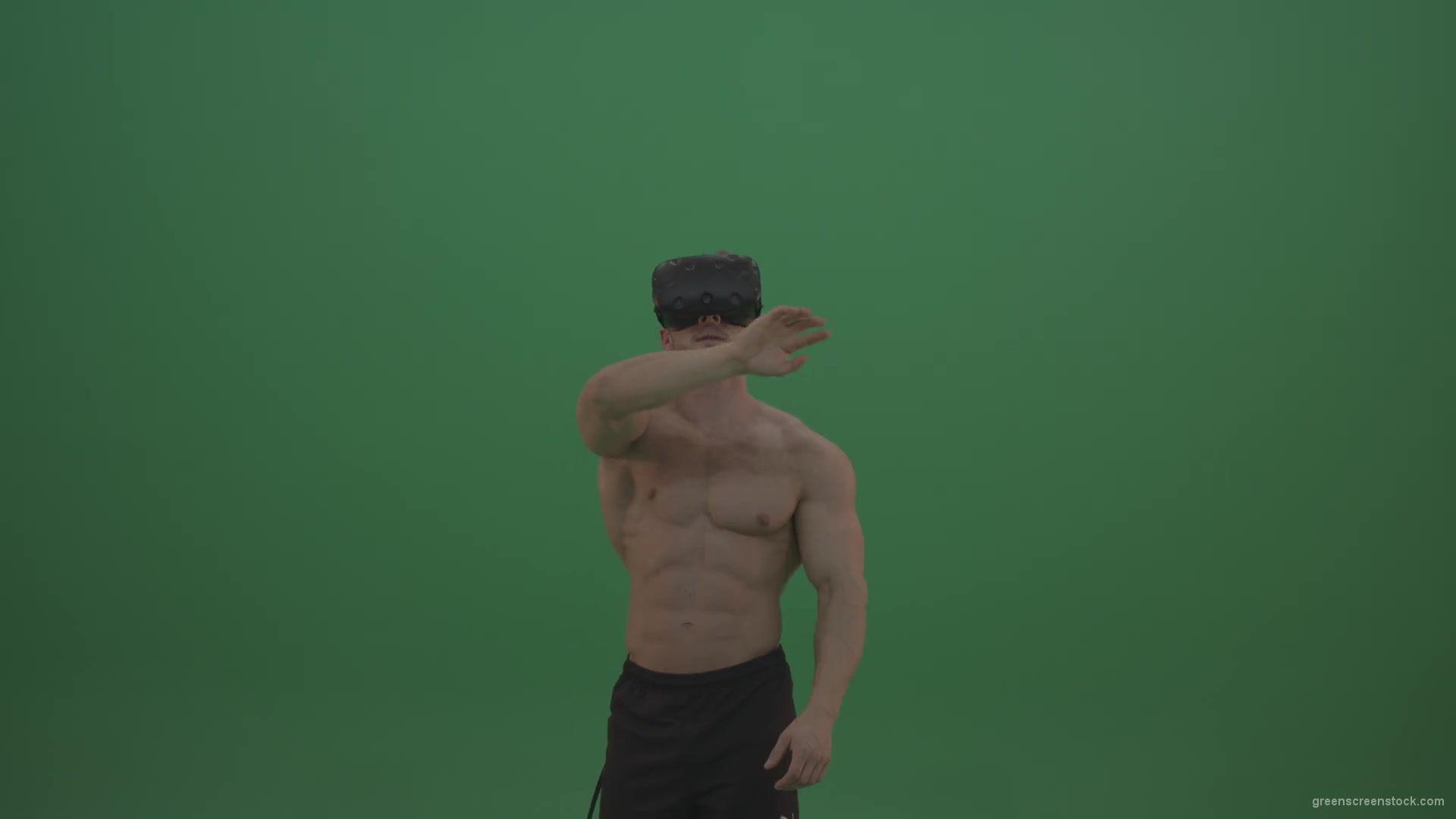Young_Athletic_Bodybuilder_Working_On_Touch_Pad_Using_Virtual_Reality_Kit_On_Green_Screen_Wall_Background-1920_007 Green Screen Stock