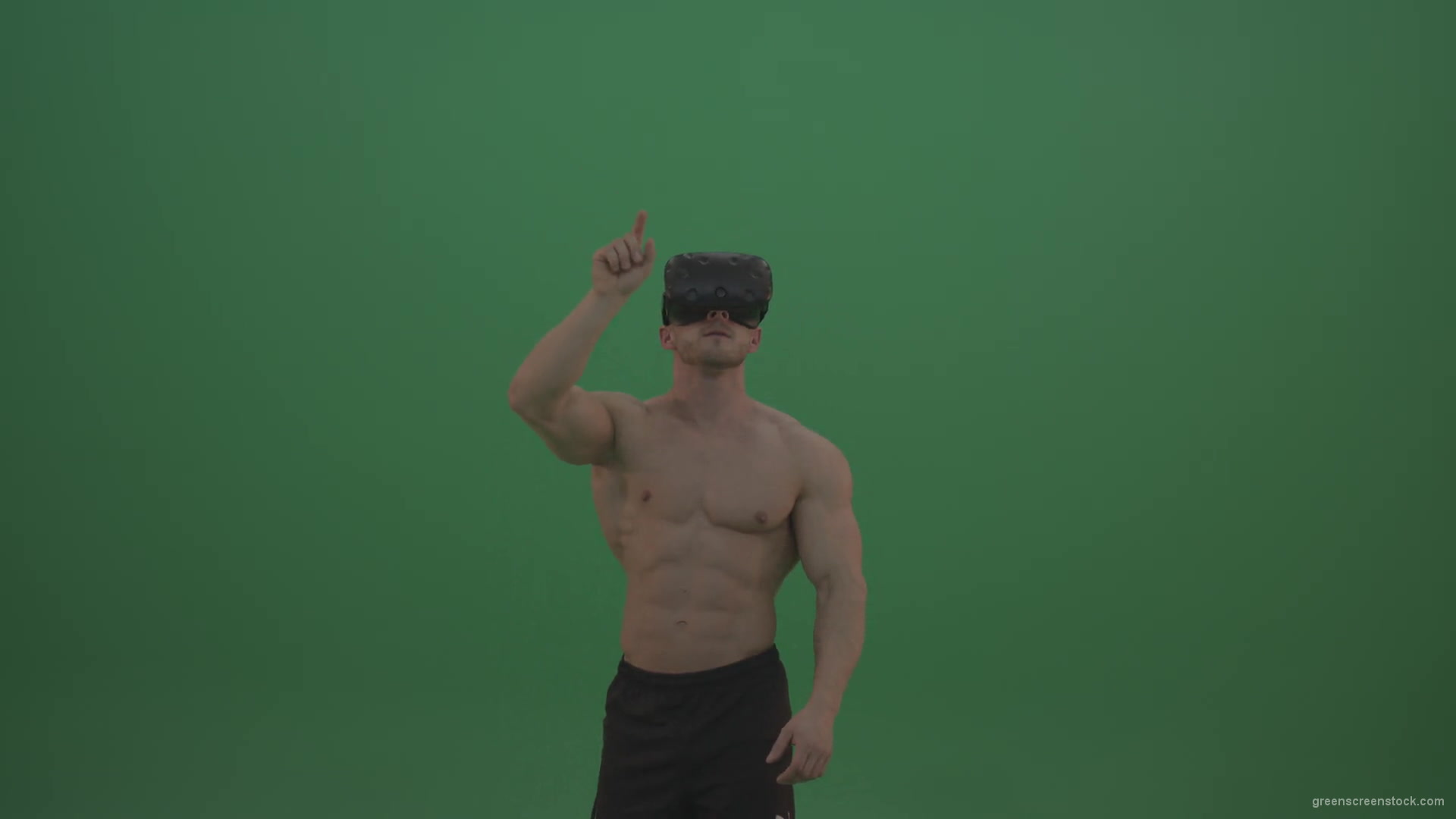 Young_Athletic_Bodybuilder_Working_On_Touch_Pad_Using_Virtual_Reality_Kit_On_Green_Screen_Wall_Background-1920_009 Green Screen Stock