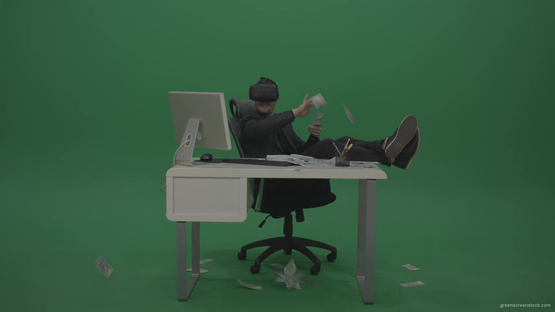 Young_Cool_Handsome_Happily_Laughing_Businessman_Sitting_At_Office_Table_Making_Money_Hasla_On_Green_Screen_Wall_Background-1920_007 Green Screen Stock