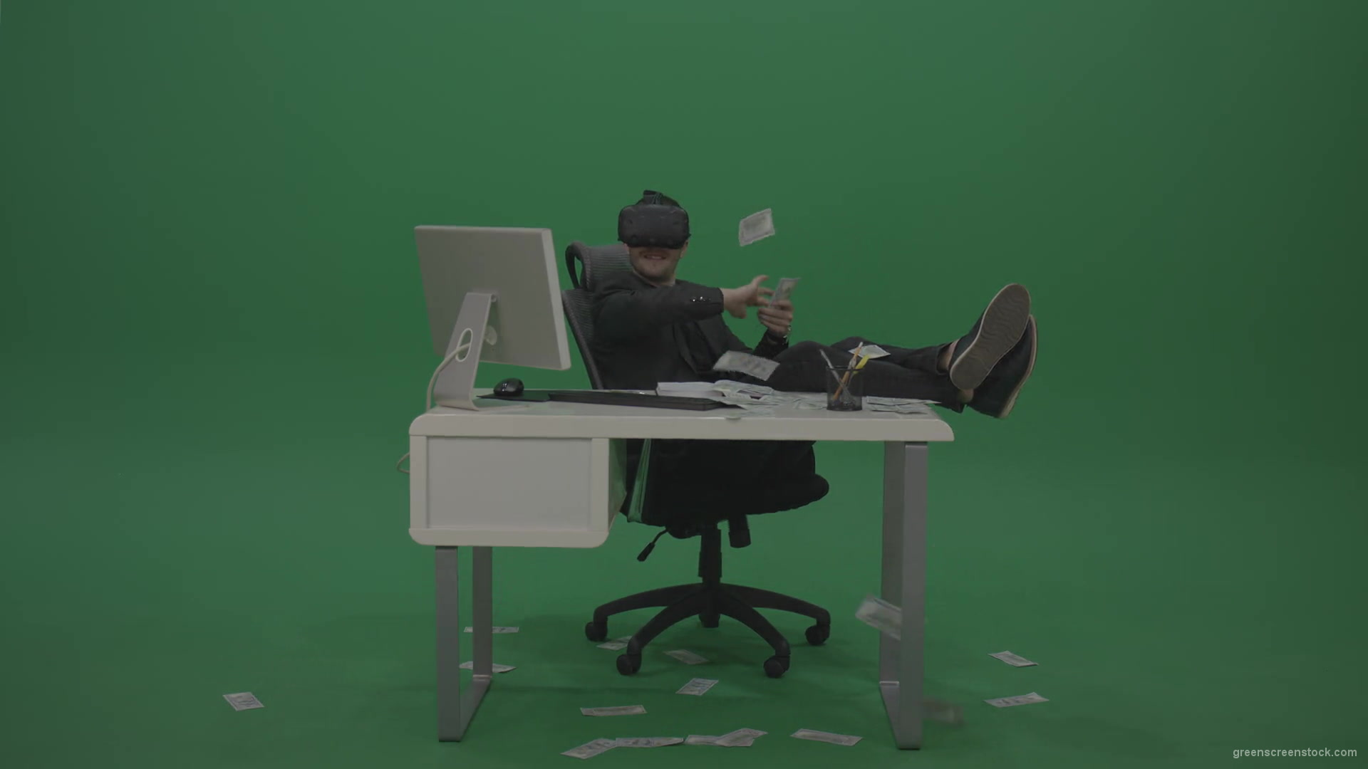 Young_Cool_Handsome_Happily_Laughing_Businessman_Sitting_At_Office_Table_Making_Money_Hasla_On_Green_Screen_Wall_Background-1920_008 Green Screen Stock