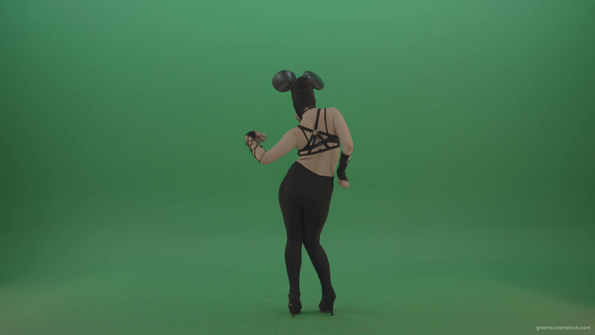 Girl-quickly-dances-in-the-style-of-Mickey-Mouse-on-the-sides-of-a-sexy-costume-on-green-screen-1920_008 Green Screen Stock