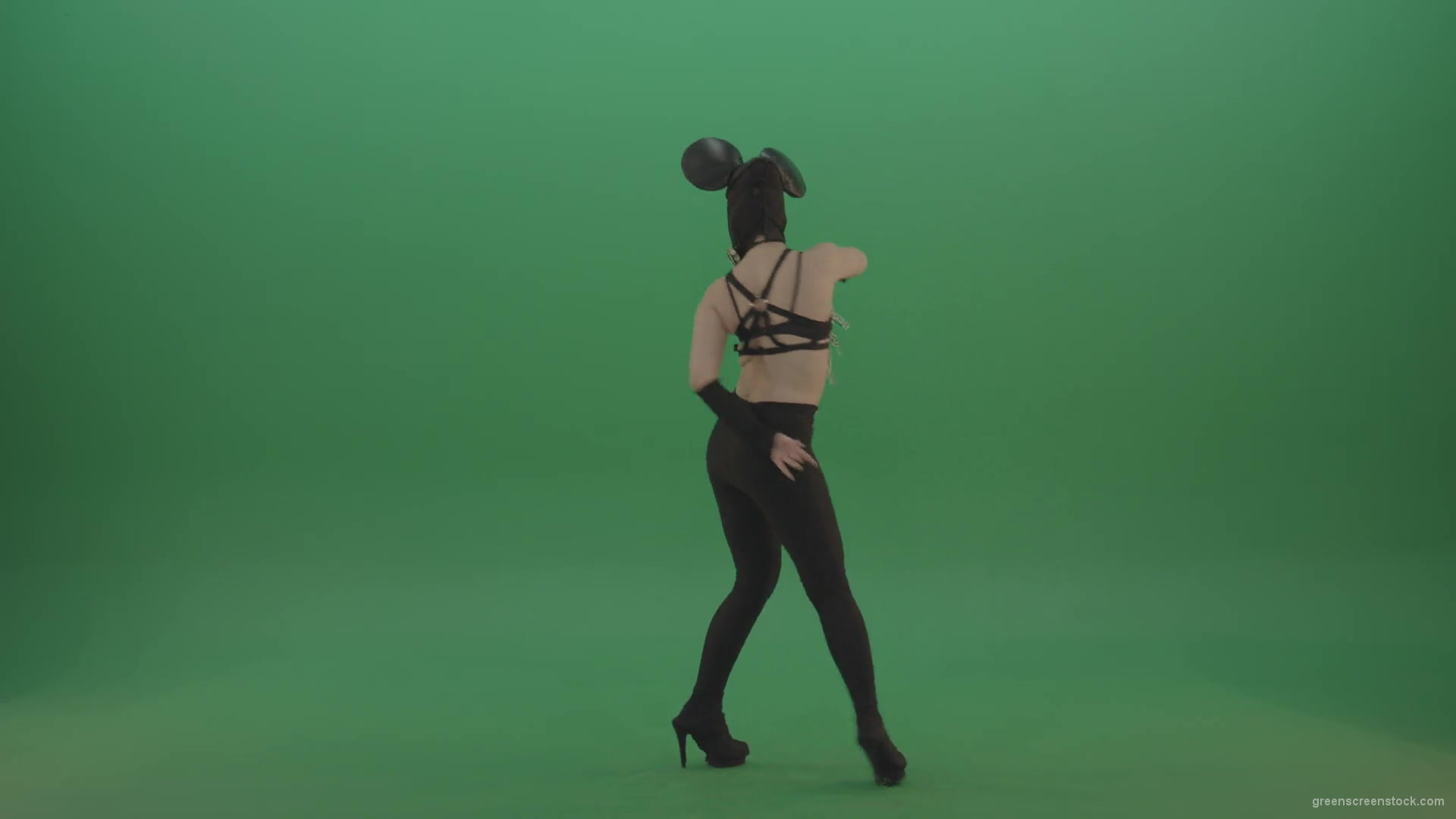 Girl-quickly-dances-in-the-style-of-Mickey-Mouse-on-the-sides-of-a-sexy-costume-on-green-screen-1920_009 Green Screen Stock