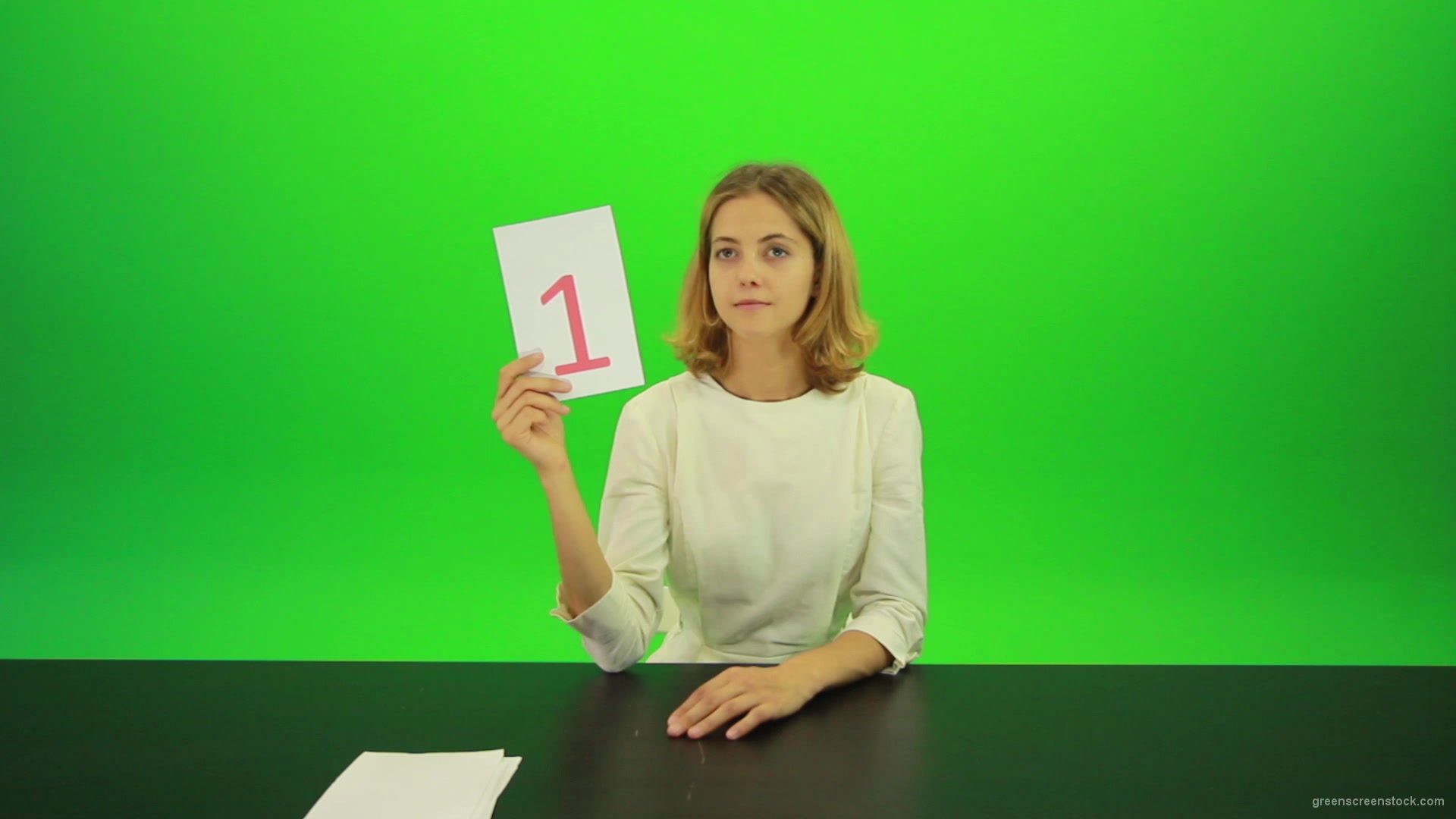 Blonde-girl-adult-gives-1-one-point-mark-score-Full-HD-Green-Screen-Video-Footage_006 Green Screen Stock