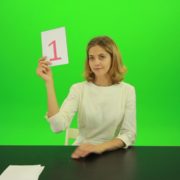 Blonde-girl-adult-gives-1-one-point-mark-score-Full-HD-Green-Screen-Video-Footage_007 Green Screen Stock