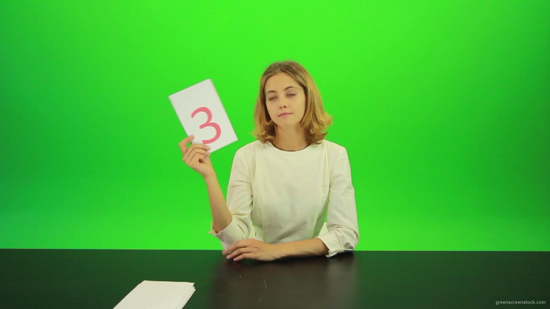 Blonde-hair-girl-in-white-shirt-give-3-point-mark-score-Full-HD-Green-Screen-Video-Footage_004 Green Screen Stock