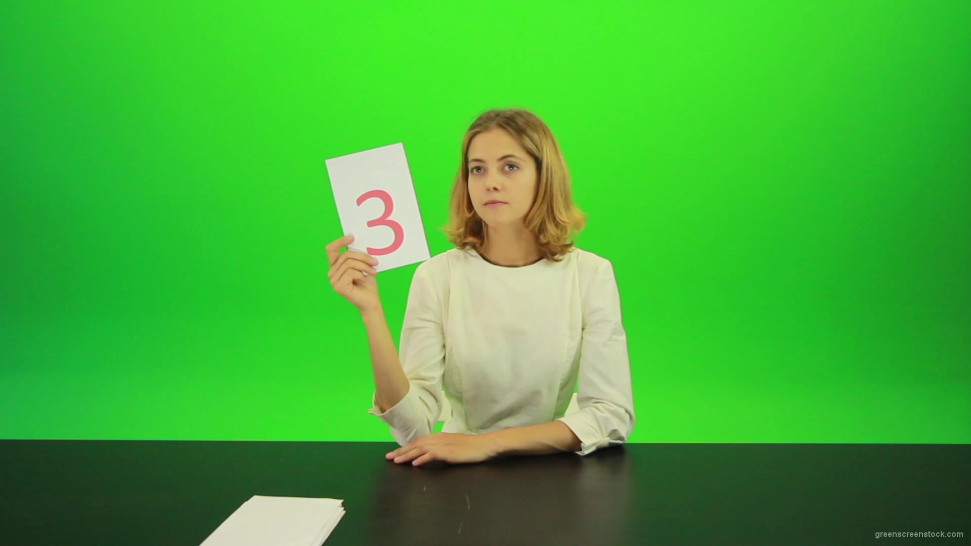 Blonde-hair-girl-in-white-shirt-give-3-point-mark-score-Full-HD-Green-Screen-Video-Footage_005 Green Screen Stock