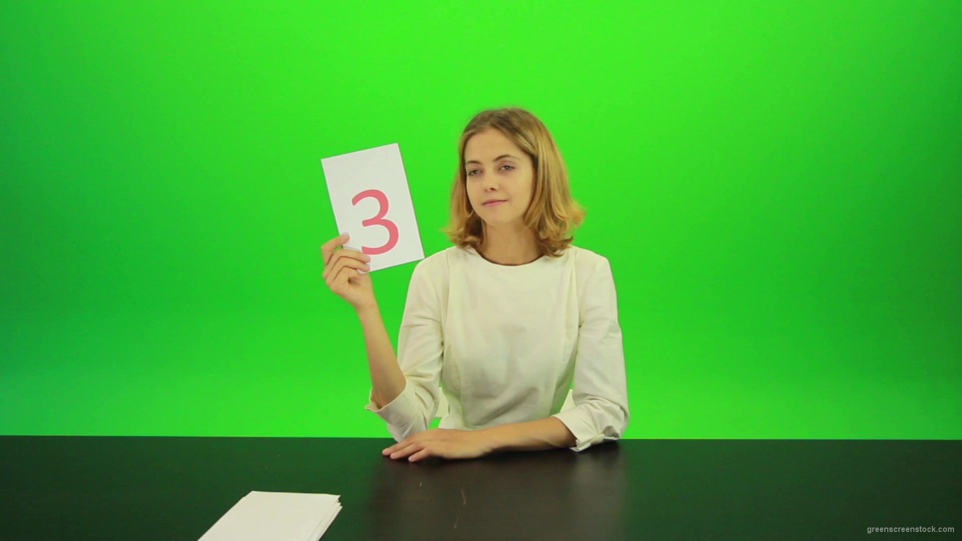 Blonde-hair-girl-in-white-shirt-give-3-point-mark-score-Full-HD-Green-Screen-Video-Footage_006 Green Screen Stock