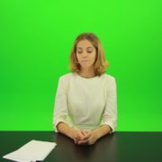 Blonde-shy-jury-gives-two-2-points-mark-Full-HD-Green-Screen-Video-Footage_001 Green Screen Stock