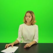 Blonde-shy-jury-gives-two-2-points-mark-Full-HD-Green-Screen-Video-Footage_002 Green Screen Stock