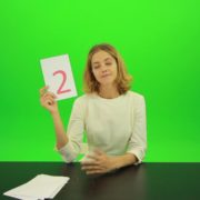 Blonde-shy-jury-gives-two-2-points-mark-Full-HD-Green-Screen-Video-Footage_007 Green Screen Stock