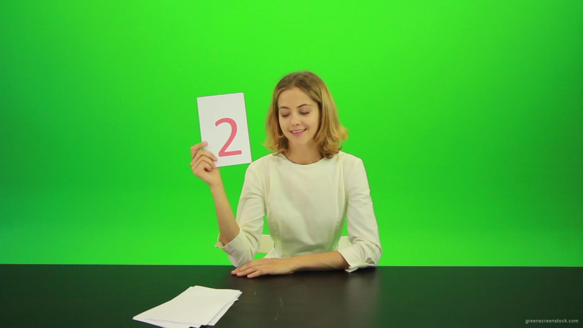 Blonde-shy-jury-gives-two-2-points-mark-Full-HD-Green-Screen-Video-Footage_009 Green Screen Stock