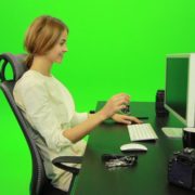 Laughing-Woman-Working-on-the-Computer-Green-Screen-Footage_005 Green Screen Stock