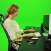 Laughing-Woman-Working-on-the-Computer-Green-Screen-Footage_007 Green Screen Stock
