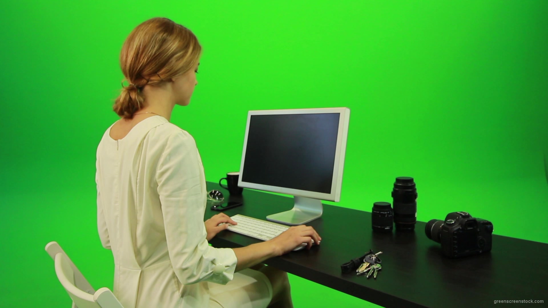 Woman-Sits-Down-and-Works-on-the-Computer-Green-Screen-Footage_006 Green Screen Stock