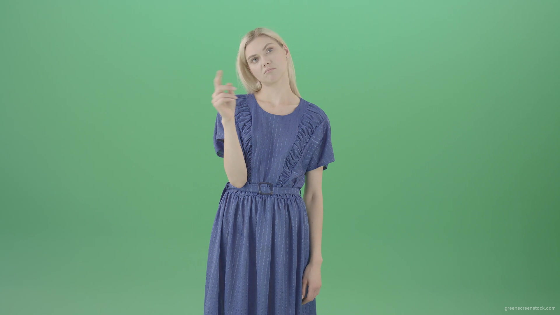 Boring-blonde-girl-in-blue-costume-can-not-find-virtual-products-on-touch-screen-isolated-on-green-background-4K-Video-Footage--1920_004 Green Screen Stock