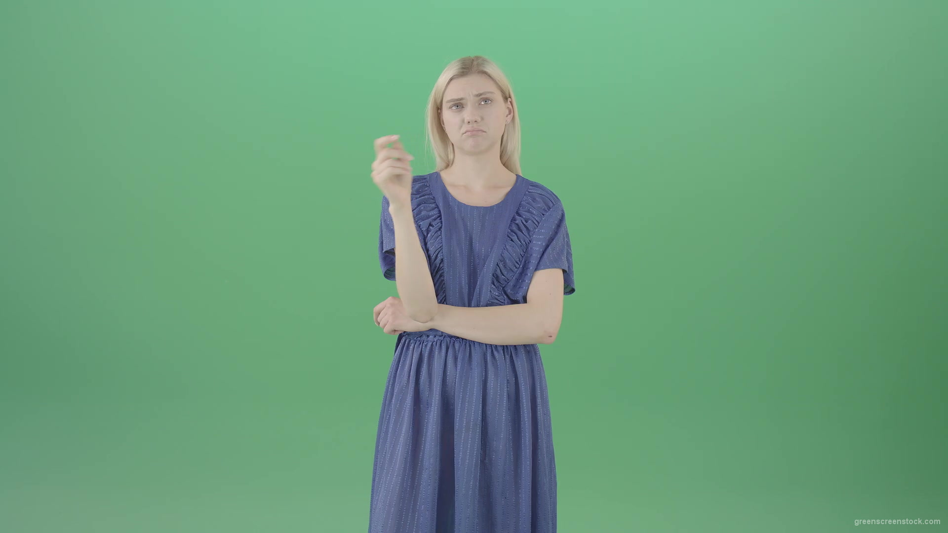 Boring-blonde-girl-in-blue-costume-can-not-find-virtual-products-on-touch-screen-isolated-on-green-background-4K-Video-Footage--1920_008 Green Screen Stock