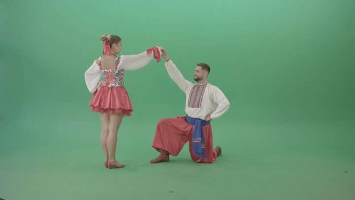 Ukraine people in folk costume dancing on green screen