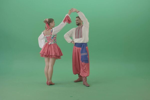Ukraine people in folk costume dancing on green screen