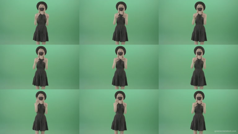 Covid-19-girl-in-black-mask-working-on-virtual-keyboard-buttons-and-touch-screen-on-green-background-4K-Video-Footage-1920 Green Screen Stock