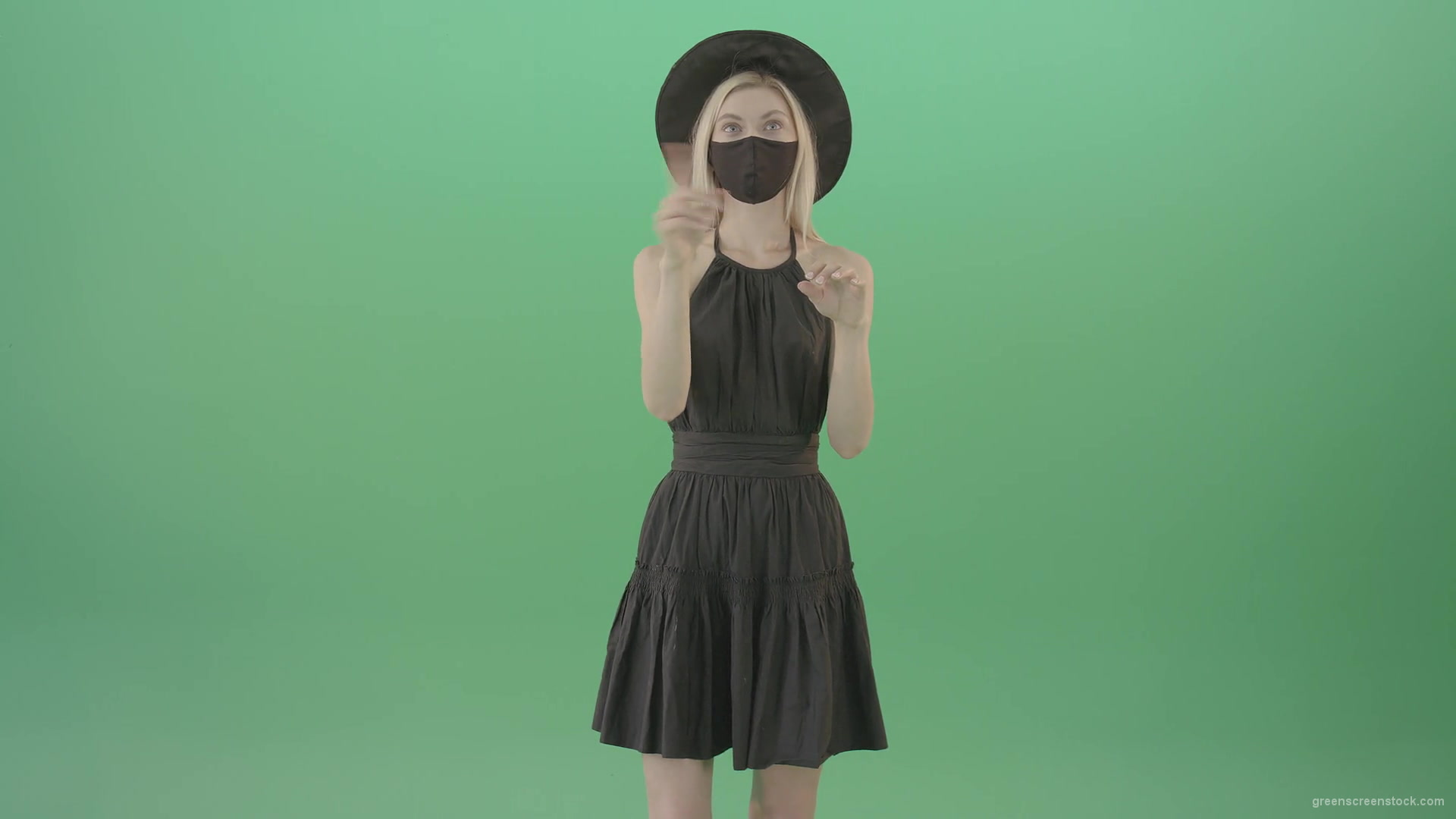 Covid-19-girl-in-black-mask-working-on-virtual-keyboard-buttons-and-touch-screen-on-green-background-4K-Video-Footage-1920_007 Green Screen Stock