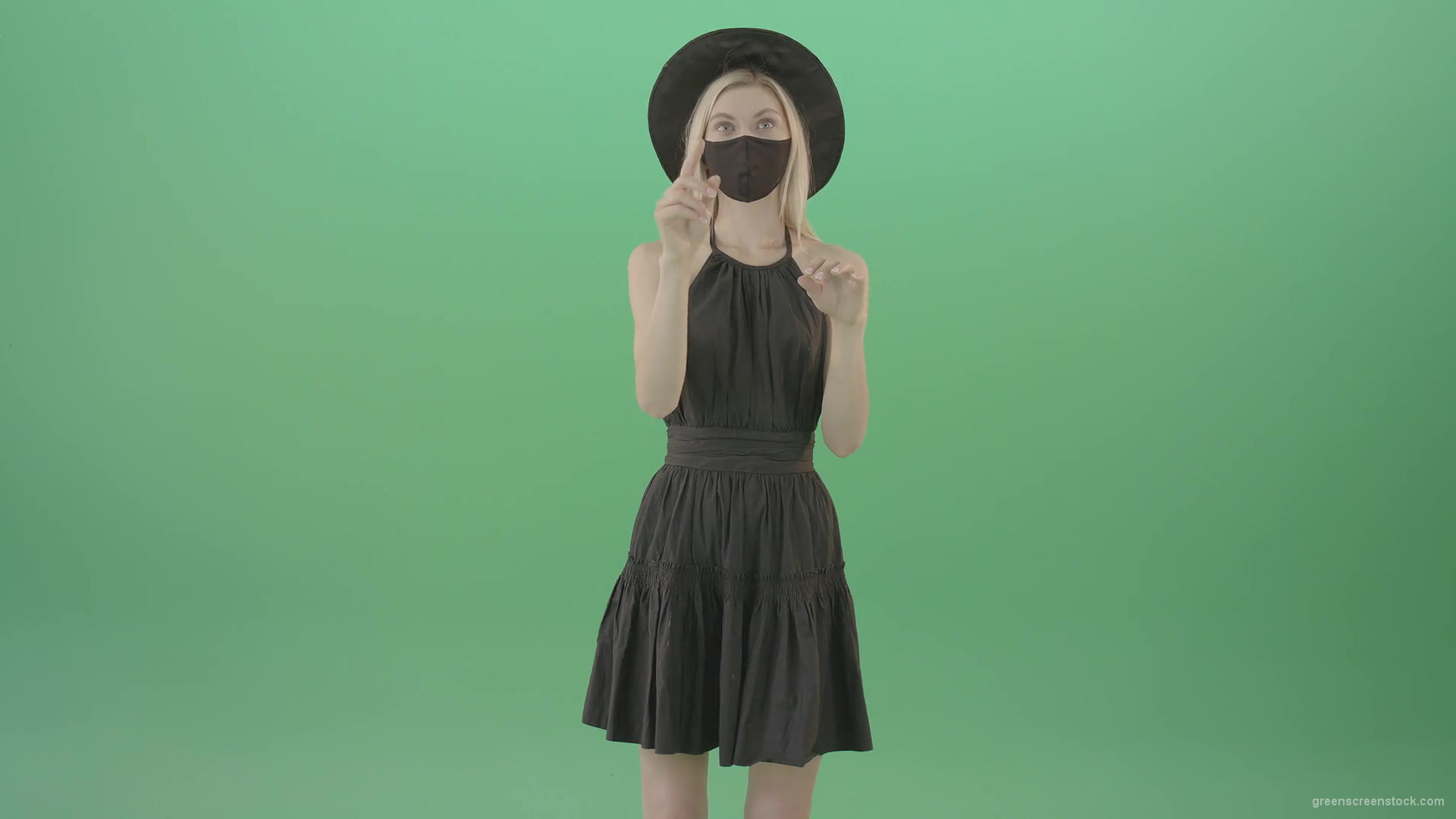 Covid-19-girl-in-black-mask-working-on-virtual-keyboard-buttons-and-touch-screen-on-green-background-4K-Video-Footage-1920_008 Green Screen Stock