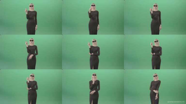 Elegant-woman-in-black-suite-searching-a-virtual-products-on-touch-screen-in-green-screen-studio-4K-Video-Footage-1920 Green Screen Stock