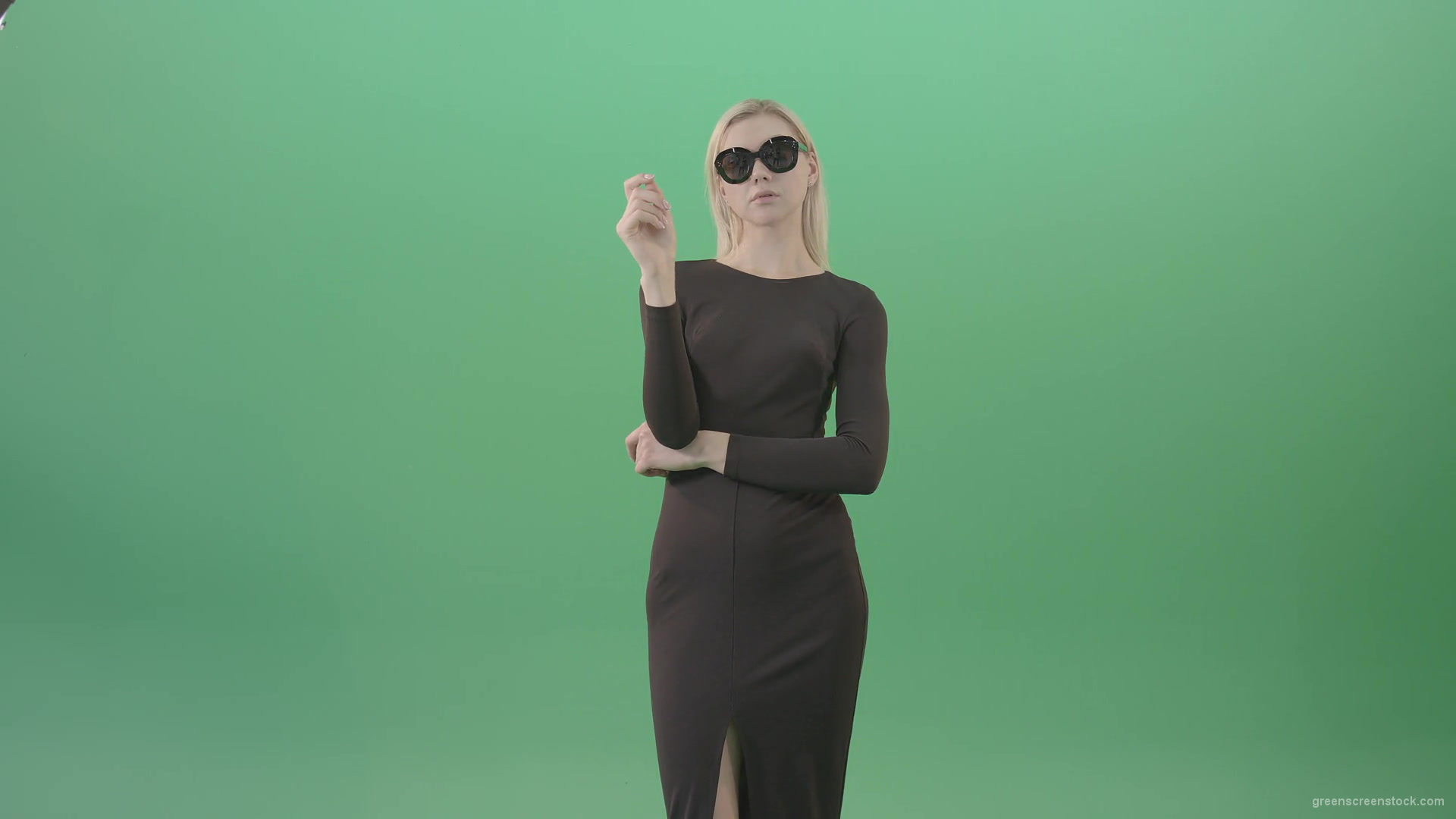Elegant-woman-in-black-suite-searching-a-virtual-products-on-touch-screen-in-green-screen-studio-4K-Video-Footage-1920_006 Green Screen Stock