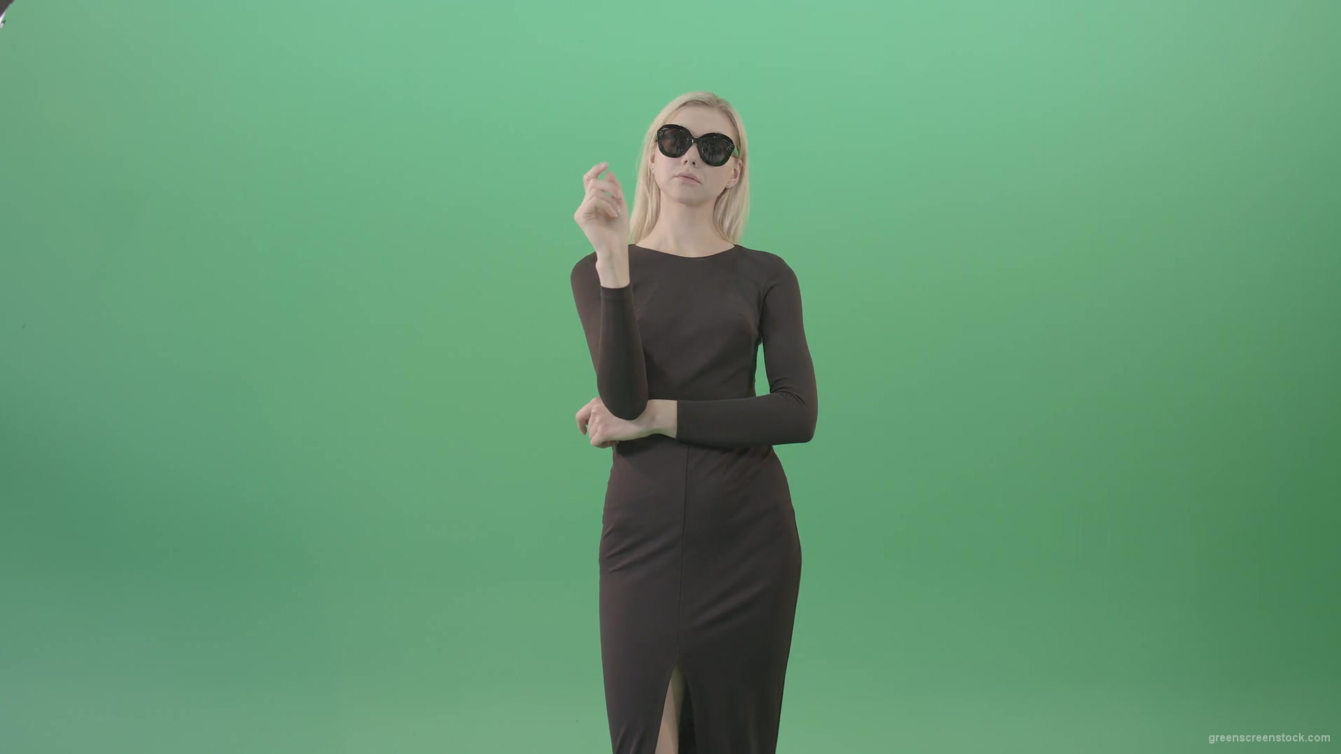 Elegant-woman-in-black-suite-searching-a-virtual-products-on-touch-screen-in-green-screen-studio-4K-Video-Footage-1920_007 Green Screen Stock