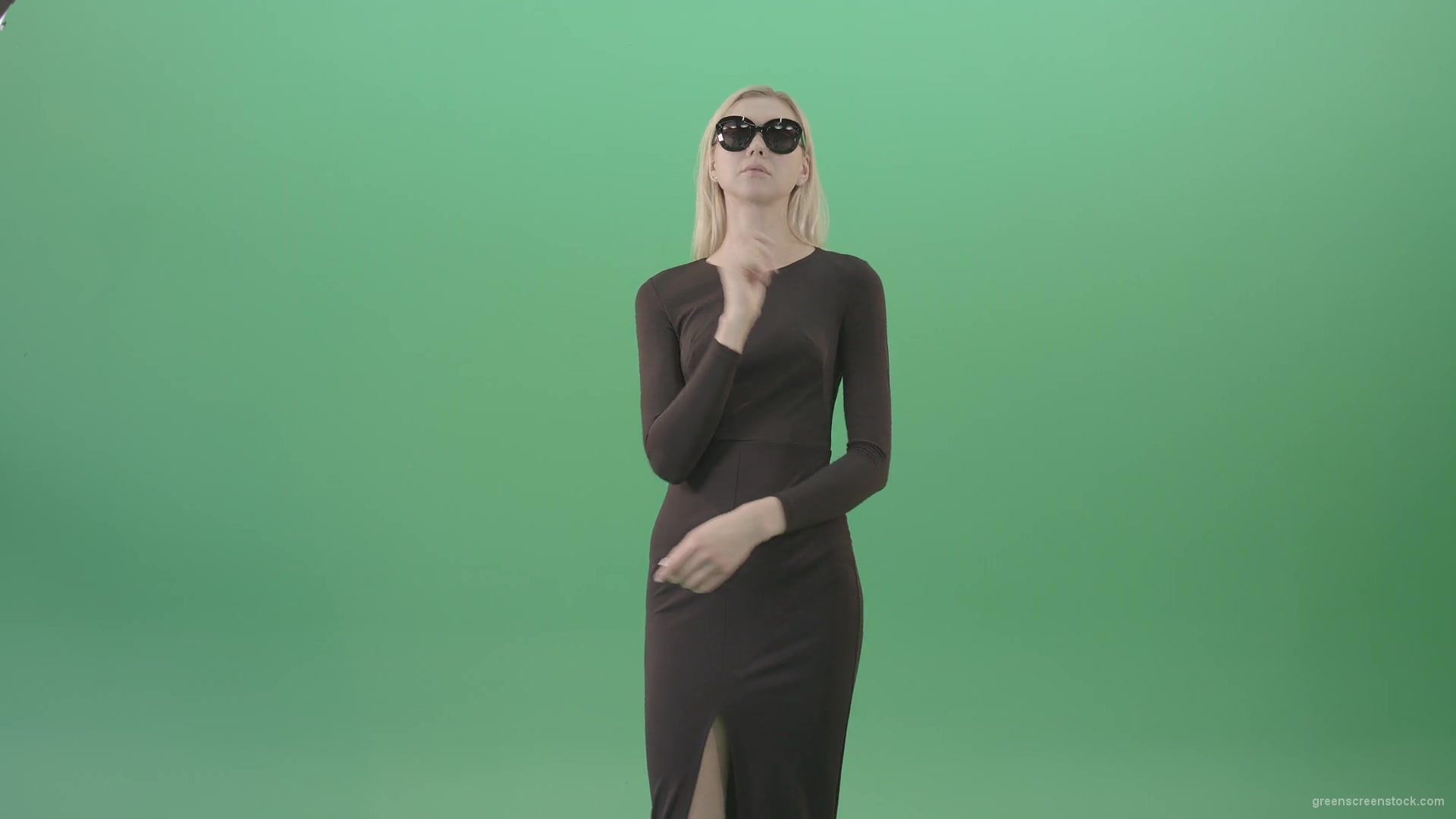 Elegant-woman-in-black-suite-searching-a-virtual-products-on-touch-screen-in-green-screen-studio-4K-Video-Footage-1920_008 Green Screen Stock
