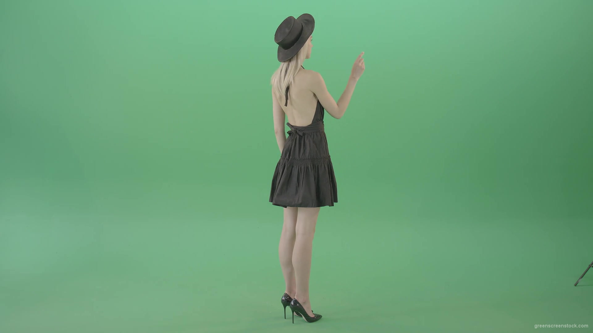 Full-size-fashion-girl-looking-virtual-products-on-touch-green-screen-4K-Video-Footage-1920_002 Green Screen Stock
