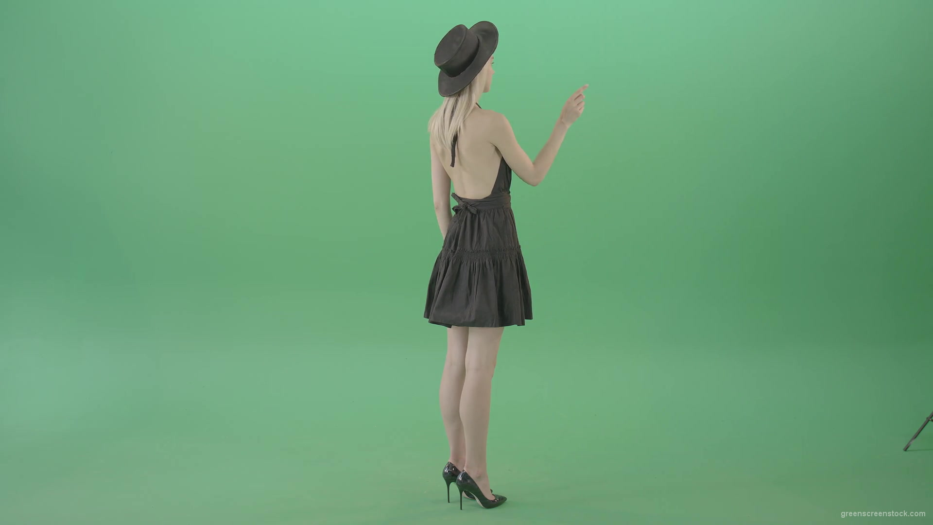 Full-size-fashion-girl-looking-virtual-products-on-touch-green-screen-4K-Video-Footage-1920_005 Green Screen Stock