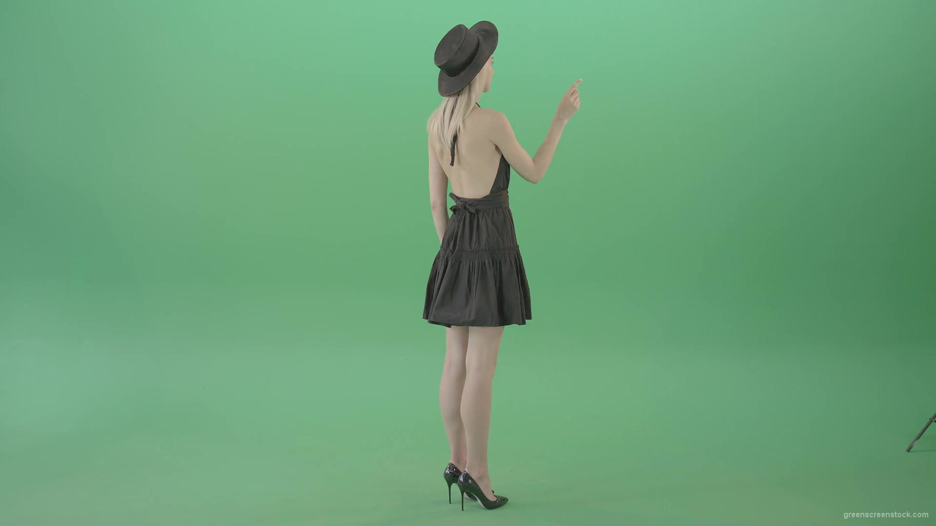 Full-size-fashion-girl-looking-virtual-products-on-touch-green-screen-4K-Video-Footage-1920_006 Green Screen Stock