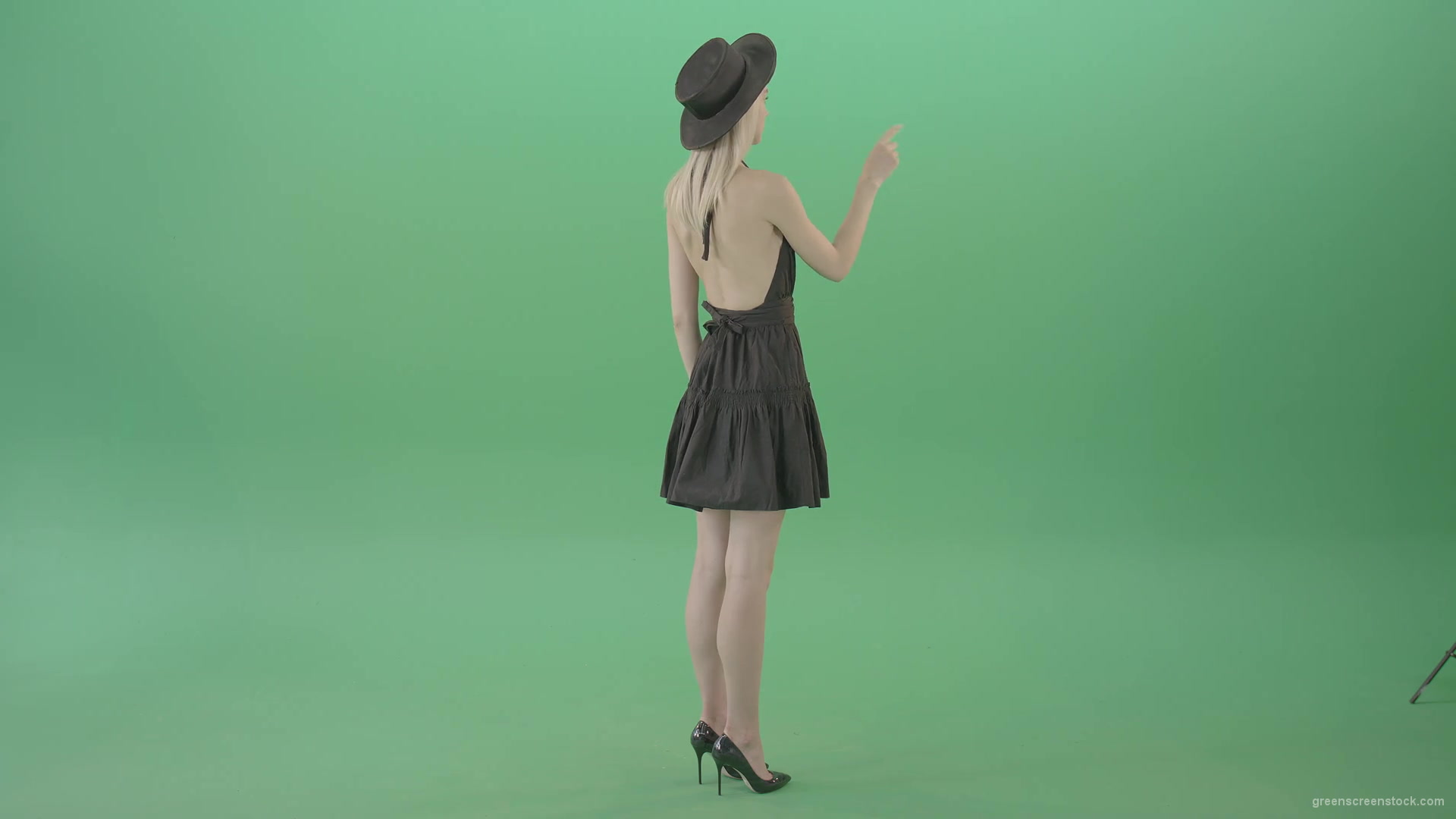 Full-size-fashion-girl-looking-virtual-products-on-touch-green-screen-4K-Video-Footage-1920_008 Green Screen Stock