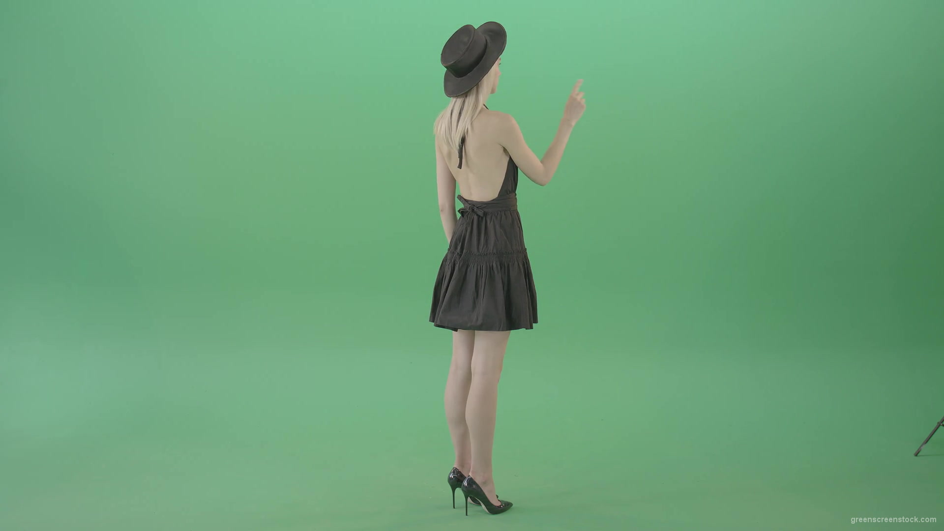Full-size-fashion-girl-looking-virtual-products-on-touch-green-screen-4K-Video-Footage-1920_009 Green Screen Stock