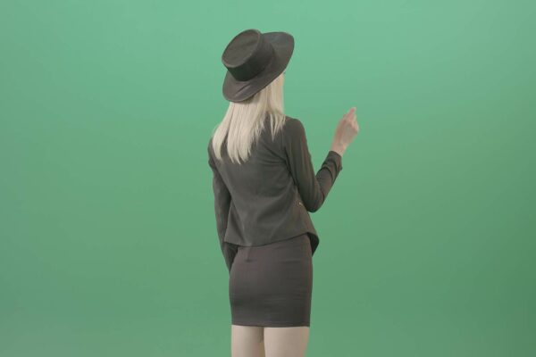 Luxury woman working with touch screen display on green screen