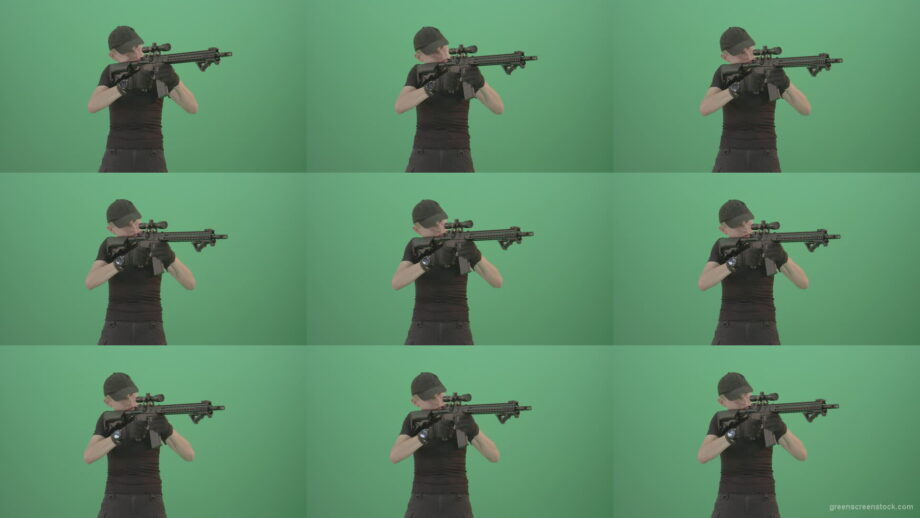 Amatory-man-with-gun-shooting-in-green-screen-studio-1920 Green Screen Stock
