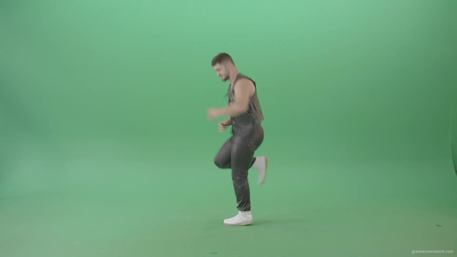 Angry-caucasian-Man-in-Black-leather-costume-dancing-Pop-Moves-on-Green-Screen-4K-Video-Footage-1920_001 Green Screen Stock