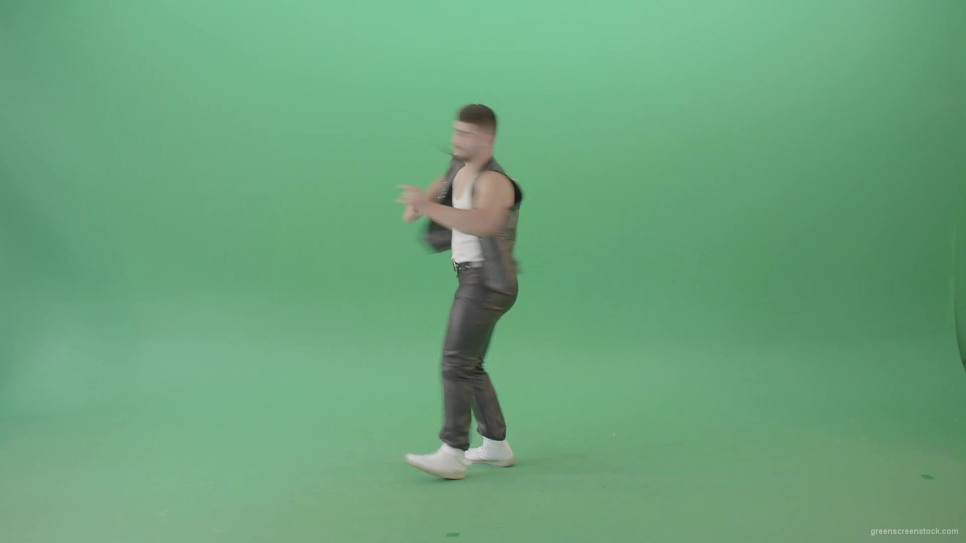 Angry-caucasian-Man-in-Black-leather-costume-dancing-Pop-Moves-on-Green-Screen-4K-Video-Footage-1920_005 Green Screen Stock