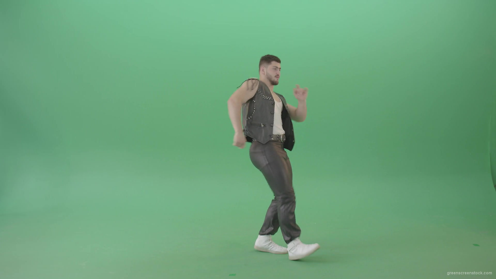 Angry-caucasian-Man-in-Black-leather-costume-dancing-Pop-Moves-on-Green-Screen-4K-Video-Footage-1920_006 Green Screen Stock