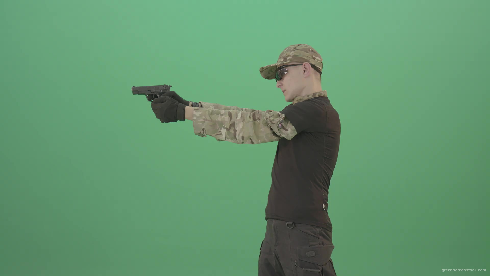 Army-Man-Assassin-shooting-with-small-gun-isolated-on-green-screen-4K-Video-Footage-1920_001 Green Screen Stock