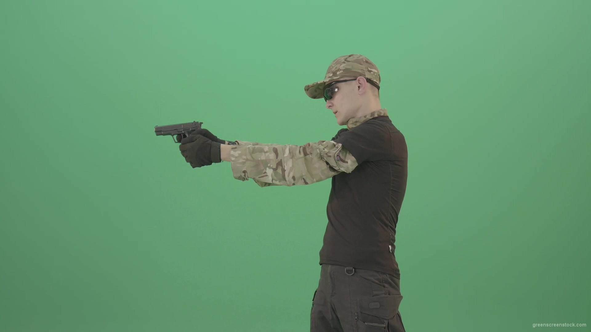 Army-Man-Assassin-shooting-with-small-gun-isolated-on-green-screen-4K-Video-Footage-1920_004 Green Screen Stock